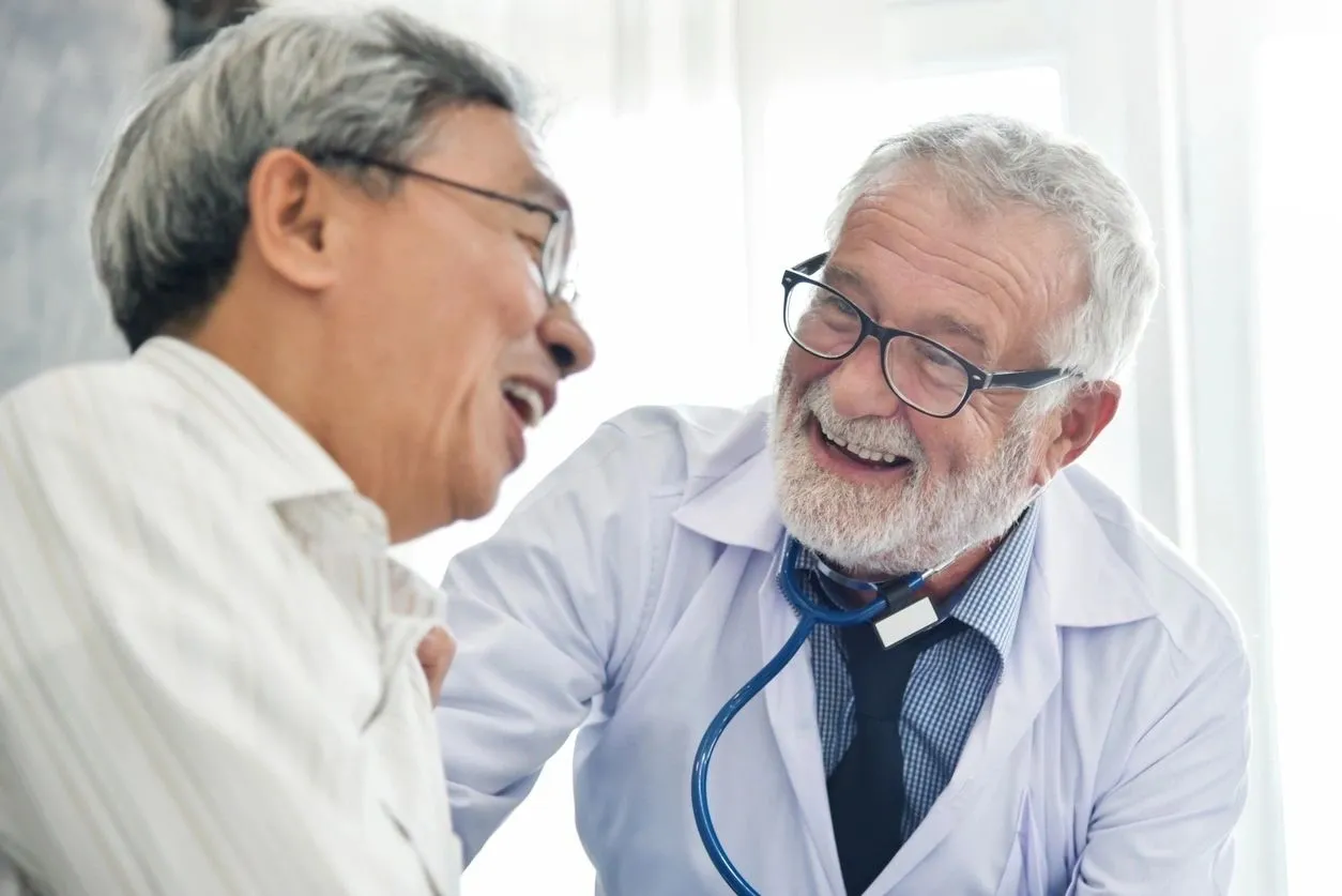 A man in white shirt and tie with a doctor.