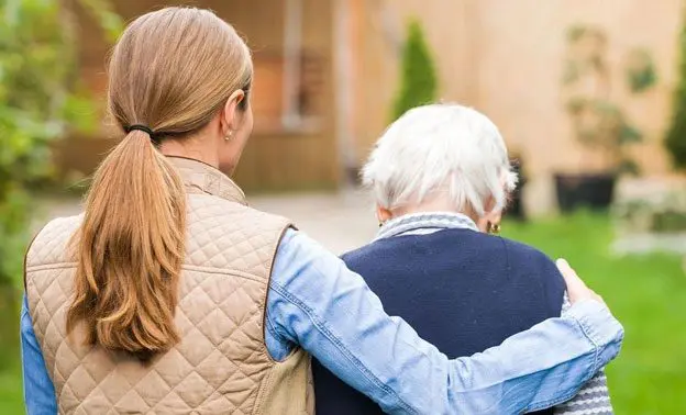 A woman and an older person are walking