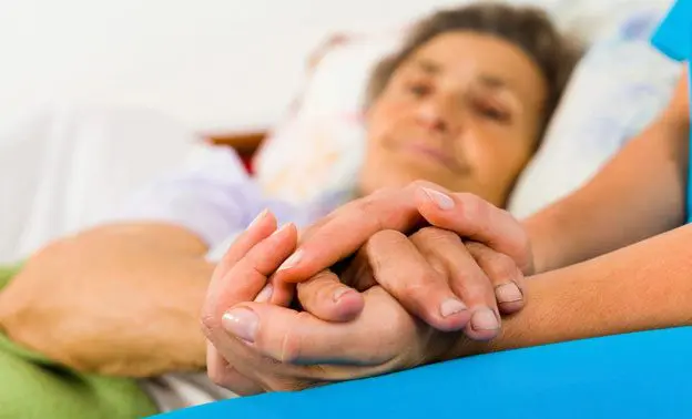 A woman holding her hands in the air.